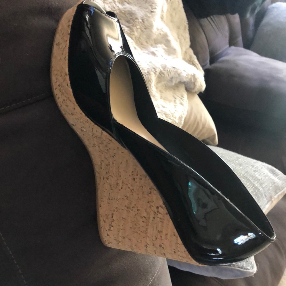 Black peep toe patent leather wedge heels